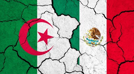 Flags of Algeria and Mexico on cracked surface - politics, relationship concept