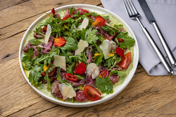 A delicious salad in a restaurant. Close-up