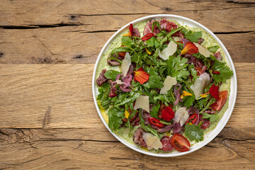 A delicious salad in a restaurant. Close-up