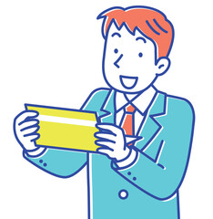 銀行の通帳を見て喜ぶスーツ姿の若い男性