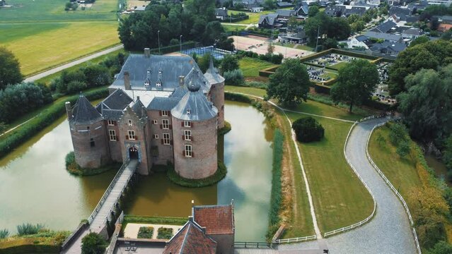 Ammersoyen castle: aerial view in a circle of the beautiful castle and the bridge and the moat that surrounds it. In the Netherlands on a sunny day.