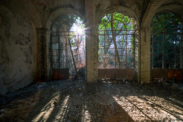 porch with broken glass in an abandoned mansion