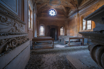 abandoned church with pews and altar
