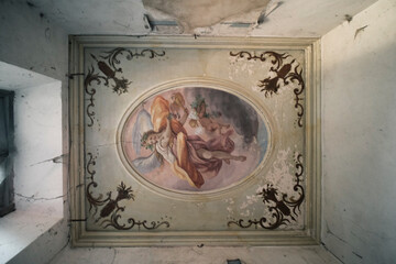 fresco on a ceiling in an abandoned villa