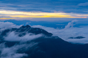 Mountain peak and sunrise covered by the sea of cloud in northern of thailand (Nan province, Thailand) เด่นช้างนอน