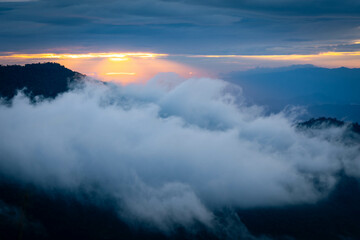Mountain peak and sunrise covered by the sea of cloud in northern of thailand (Nan province, Thailand) เด่นช้างนอน