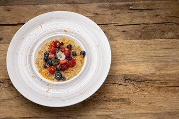 a delicious breakfast. Oatmeal with berries. Close-up