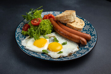 Delicious breakfast. eggs fried in a pan. Close-up