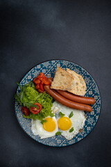 Delicious breakfast. eggs fried in a pan. Close-up