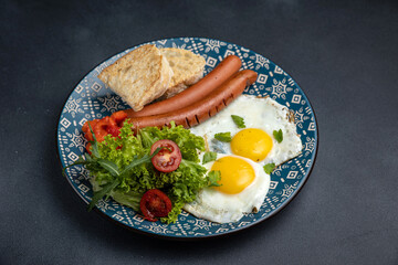Delicious breakfast. eggs fried in a pan. Close-up