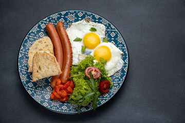 Delicious breakfast. eggs fried in a pan. Close-up
