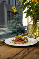 Сrouton with avocado, tomatoes and basil. 