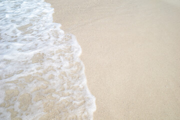 Foam wave on sand beach, summer holiday concept