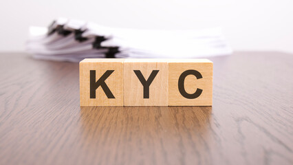 KYC letters on wood block cubes on wooden table, business to business marketing and strategy concept