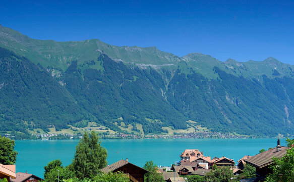 Iseltwald in Switzerland, fairytale small village and beautiful Bay on the southern shore of  the Lake Brienz in the Bernese Oberland with view on Emmental alps mountains with Brienzer Rothorn

