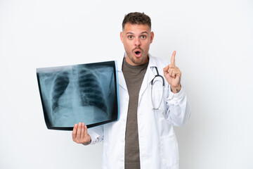 Professional traumatologist caucasian man isolated on white background intending to realizes the solution while lifting a finger up