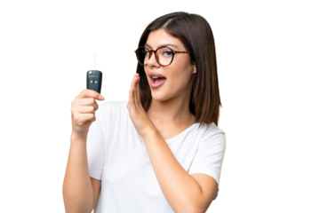 Young Russian woman holding car keys over isolated chroma key background whispering something
