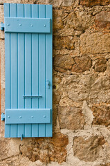 Obraz na płótnie Canvas Blue shutters on French rural house in Auvergne region of France