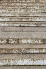 Old concrete stairs with shabby paint.