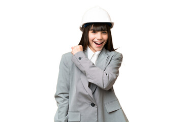 Little girl playing as a architect with helmet and holding blueprints over isolated background celebrating a victory
