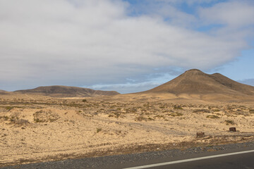 View of the strange, unfriendly but fascinating deserted landscape of the island volcanoes of the center of Fuerteventura. North part of the island.