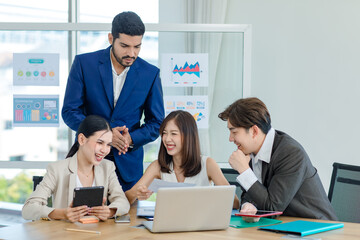  Asian professional successful male businessmen and businesswomen colleagues in formal business suit discussing brainstorming working stern looking serious stressed as teamwork at work place