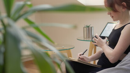 Feel comfortable and focused watching a woman work from home, keeping her thoughts on paper, finding inspiration, and unleashing her potential.