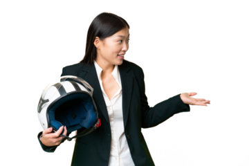 Young Asian woman with a motorcycle helmet over isolated chroma key background with surprise expression while looking side
