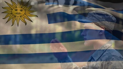 Animation of flag of uruguay over caucasian male soldier - Powered by Adobe