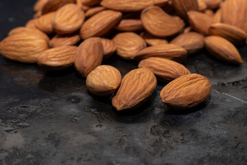 organic almond (prunus dulcis) on stone or concrete background