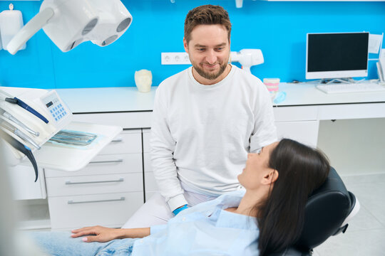 Woman visiting dentist office, routine check-up to prevent dental problems