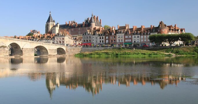 Looking across the Loire river to the town of and Chateau de Gien, Loiret, France. In the background the spire of the Saint Joan of Arc church can be seen.