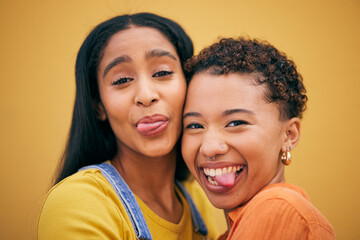 Selfie with tongue, fashion and portrait of women on yellow background by wall with trendy clothes, smile and style. Happy, summer clothes and face of female people on holiday, vacation and weekend