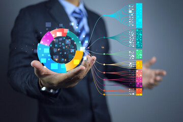 Businessman hand holding chart on big data technology. Scientist computing, analysing and...