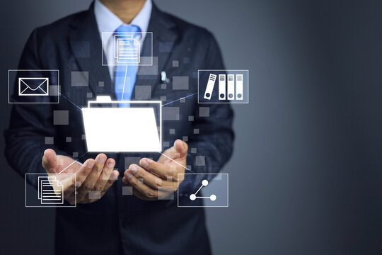 Document management system  DMS. Businessman working with folder to open file, sharing send email or searching in hand. Digital transformation information technology.
