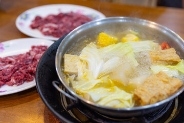 Fresh raw slice of beef in Hot Pot restaurant