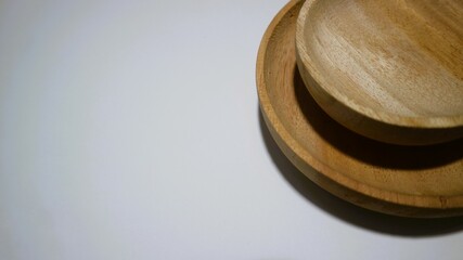 Set of empty wooden saucers isolated on white background, copy space