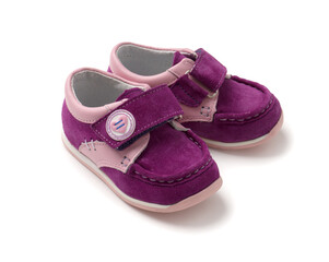 Violet pink new shoes for girls. Casual girlish suede shoes for toddlers on a white background.