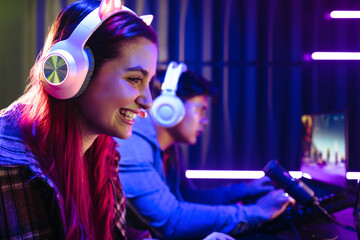 Happy female gamer winning a video gaming contest