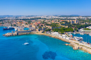 Fototapeta premium Mandraki port with fort of St. Nicholas and windmills, Rhodes, Greece. 