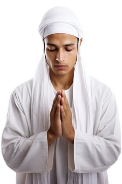 Muslim man in white clothing, including a turban, praying with hands together. Fictional Character Created By Generative AI.