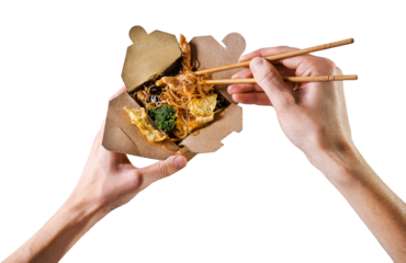 man eating thai noodles with vegetables from a cardboard box with chopsticks  on a transparent background