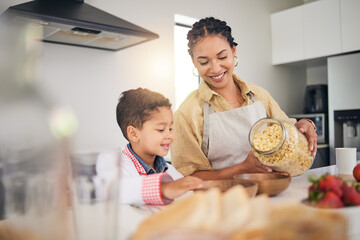 Breakfast, smile and a mother and child cooking, baking or helping with food in the kitchen. House, eating and a boy kid and a young mom teaching during lunch or for dinner together while hungry