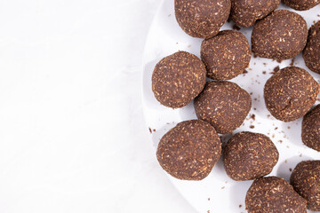 Chocolate cocoa ball cookies served on the plate with copy space