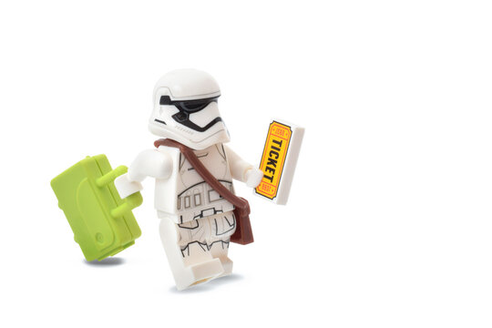 Lego minifigure of stormtrooper Star Wars as tourst with bag as stop war concept. Editorial illustrative image of popular plastic toy constructor.