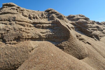 Sand landscape. Sand mountains. Sea sand close up. Selective focus.