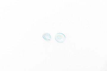 contact lenses isolated with solution in bottle and case, box holder.lens on finger. dried...