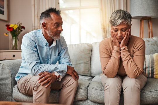 Angry, senior couple and fight on couch, conflict and depression with a breakup, cheating or stress. Divorce, old woman or elderly man with mental health, home or separation with crisis or retirement
