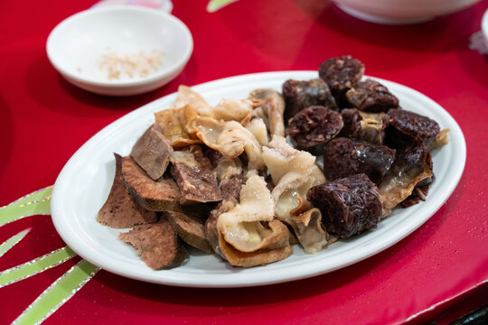 Delicious Korean cuisine Sundae and other pork edible viscera in market, street food.