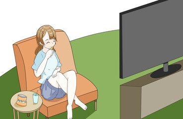 お菓子を食べながらテレビを見る女性